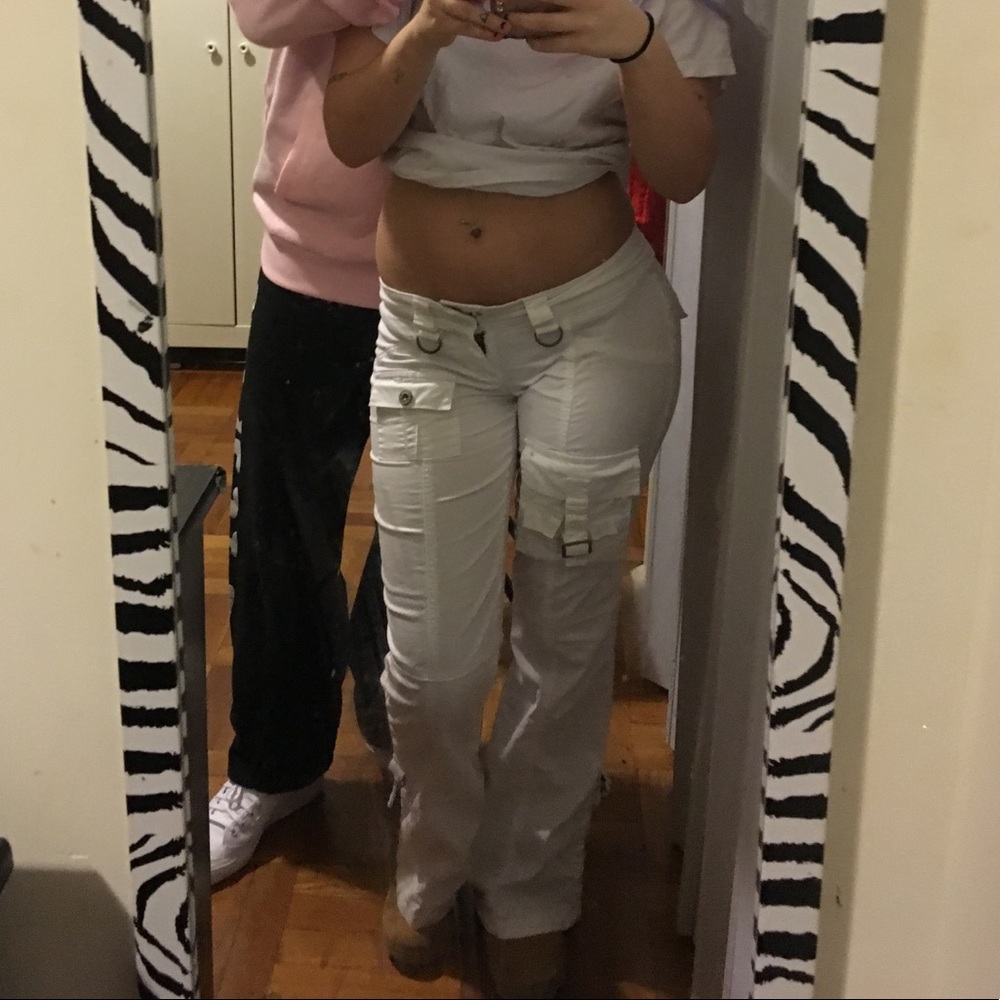 White (now slightly pink) buckled flare pants